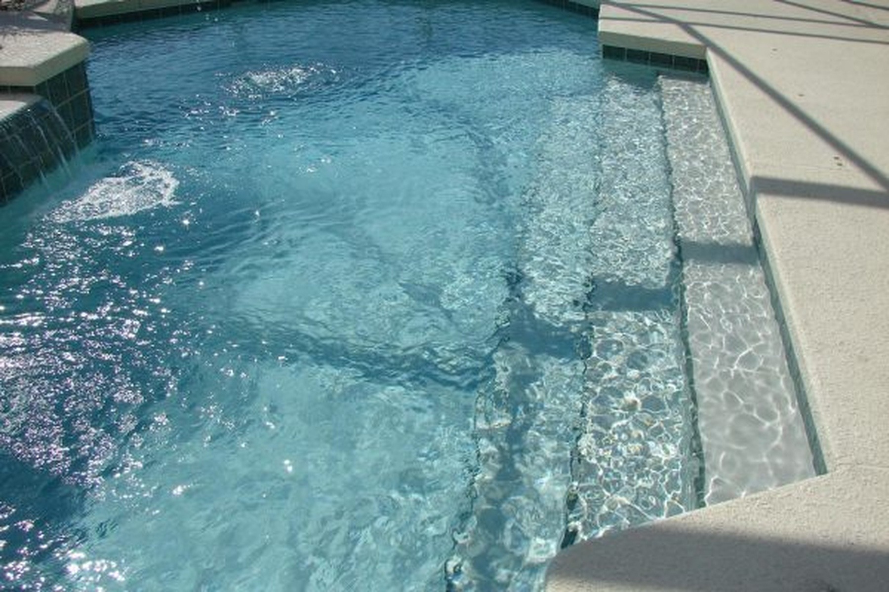 Swimming Pool Water Surface Showing Texture and Light Reflections
